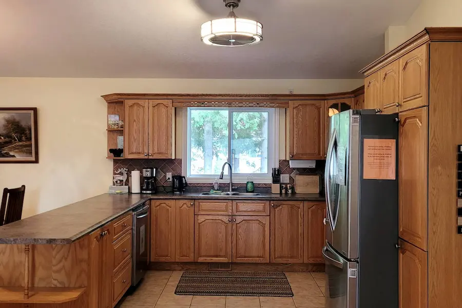 Full kitchen with oak cabinets and stainless steel appliances