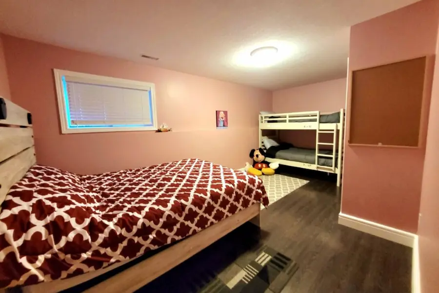 Kids bedroom with double bed and bunk beds